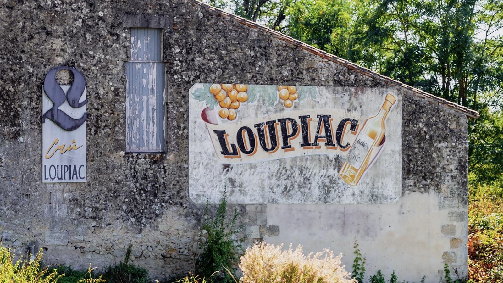 Ein verblichenes Werbe-Wandbild bei Loupiac. Foto: Hilke Maunder