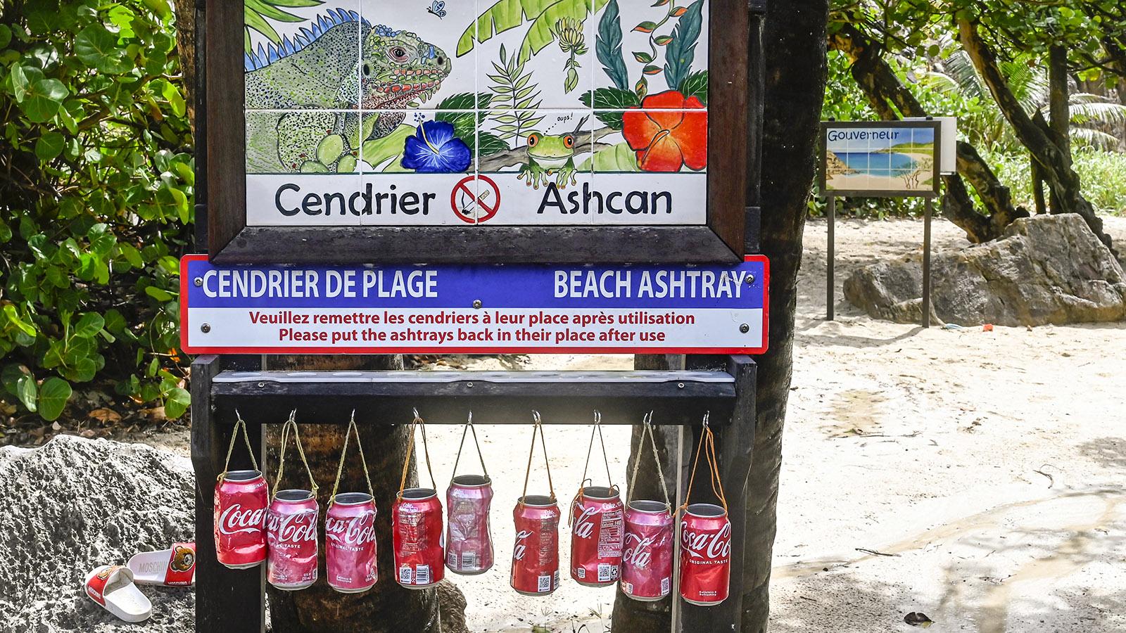 An der <em>Plage du Gouverneur</em> dienen recycelte Cola-Dosen als Strandaschenbecher. Foto: Hilke Maunder